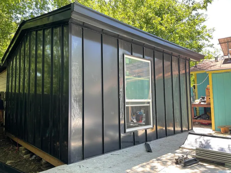 Black standing seam metal wall panels for Roof Inspection in Tittabawassee