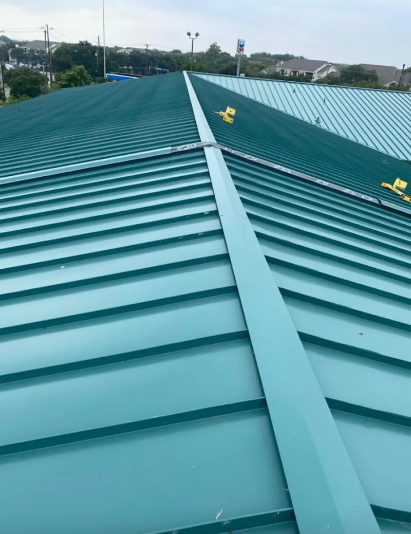 Green commercial metal roof ridge and valley for Metal Roof Repair in Tittabawassee